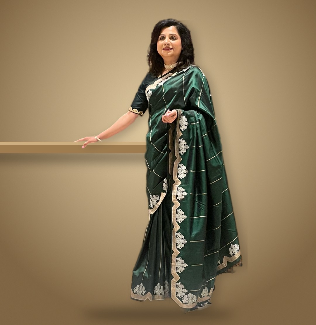 Sonali, founder of Ameyaa Collections, in a bottle-green Benarasi saree with silver motifs