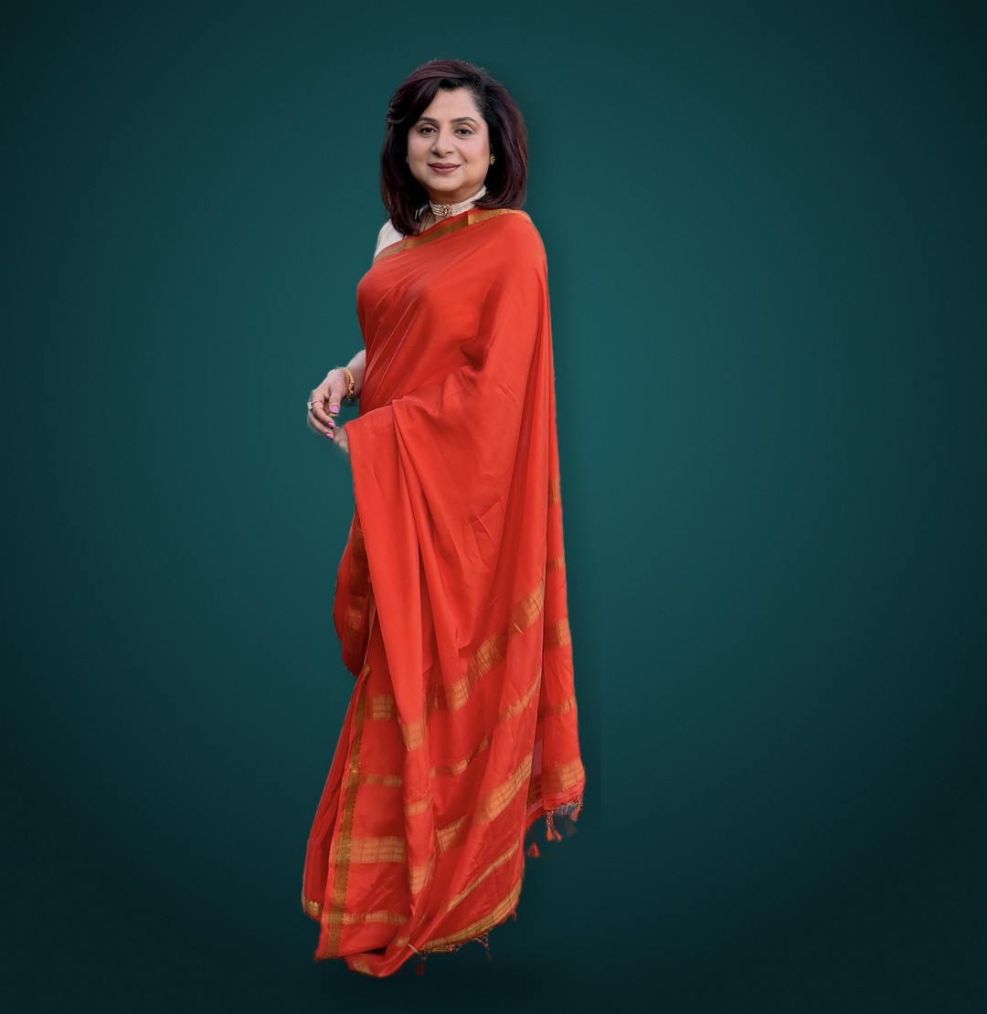 Sonali, founder of Ameyaa Collections, in an orange Mysore silk saree